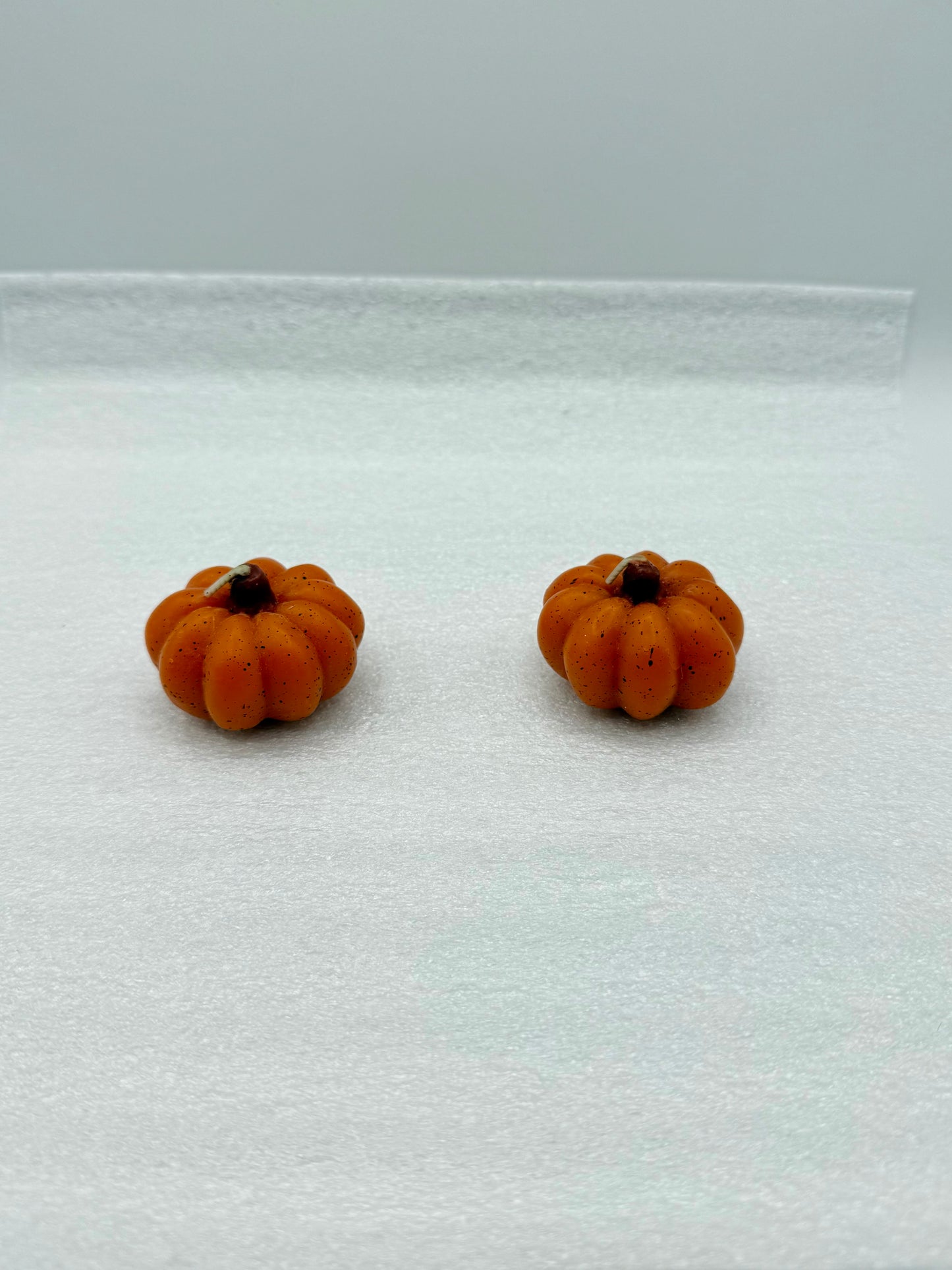 Set of small pumpkin candles