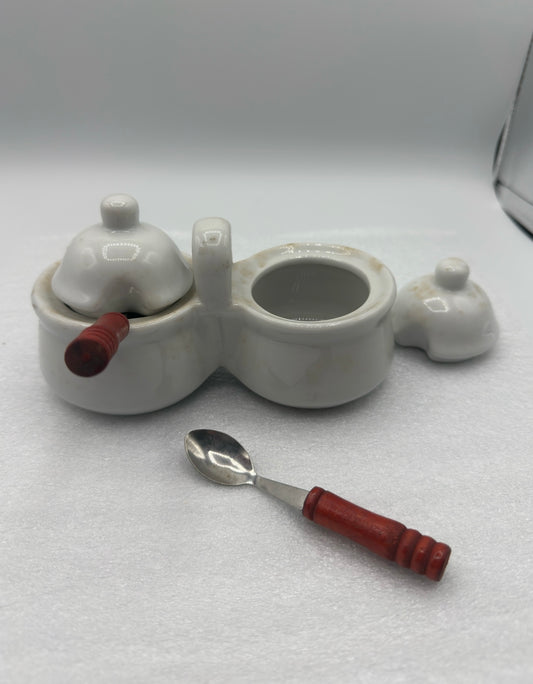 Double Lidded Condiment Ceramic Jar with Red-Handled Spoons